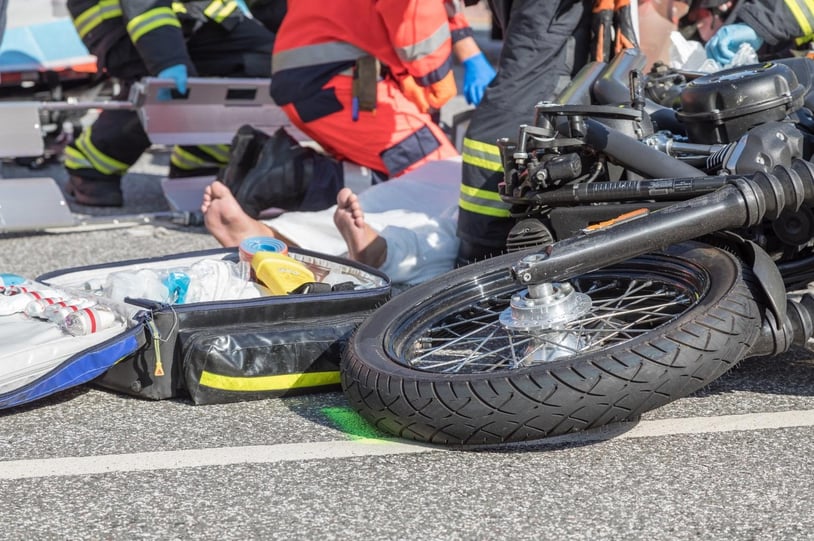 A motorcyclist who has been injured in an accident and is being care for by emergency responders in Acworth, Georgia