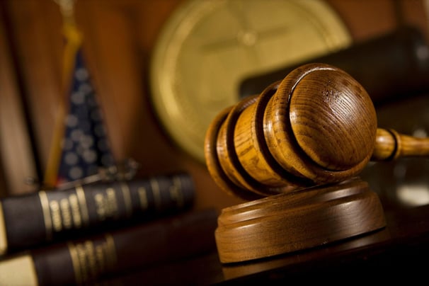 A judges gavel on a desk in a courtroom in Evans