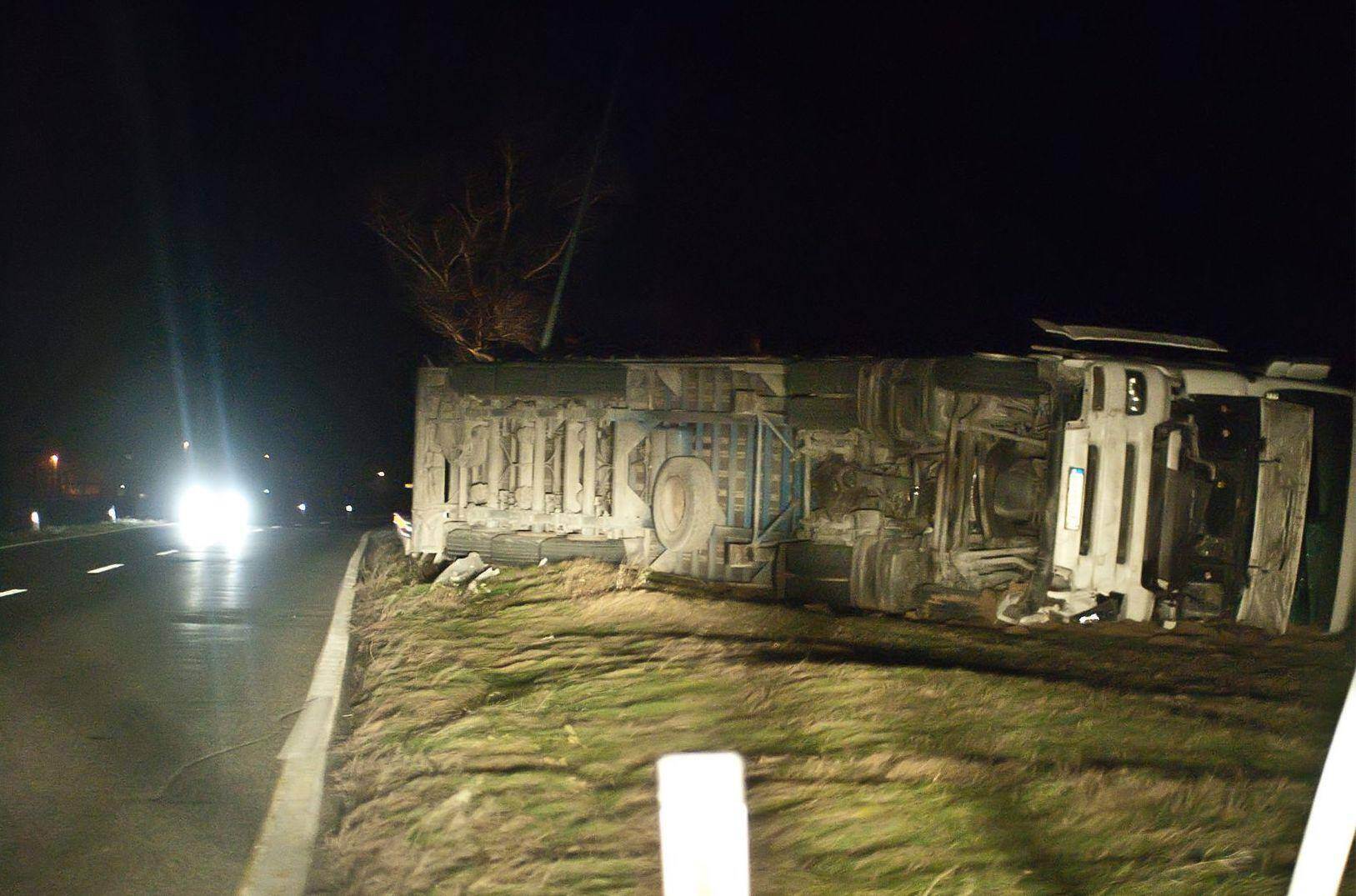 A truck that has wiped out in the middle of the night and is now flipped over in Americus, Georgia