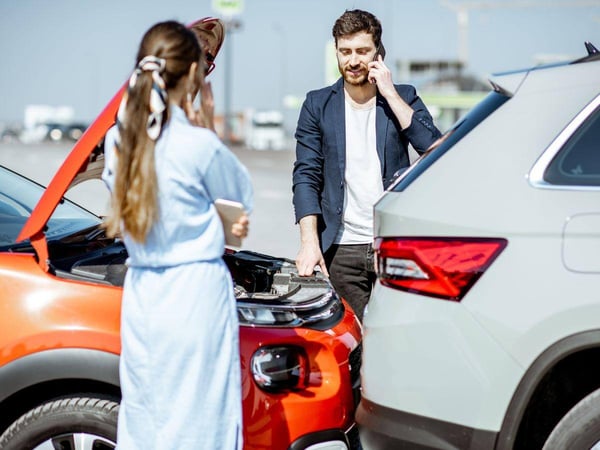 Two-Younger-Individuals-Handling-a-Car-Accident-in-Atlanta