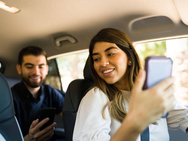 Female rideshare driver transporting a male passenger