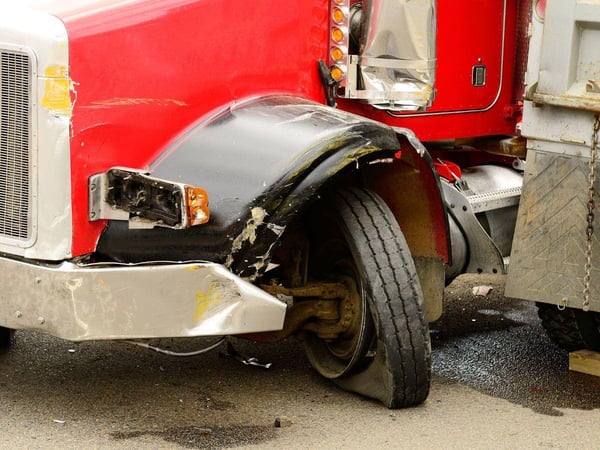 semi-truck with a flat tire after an accident