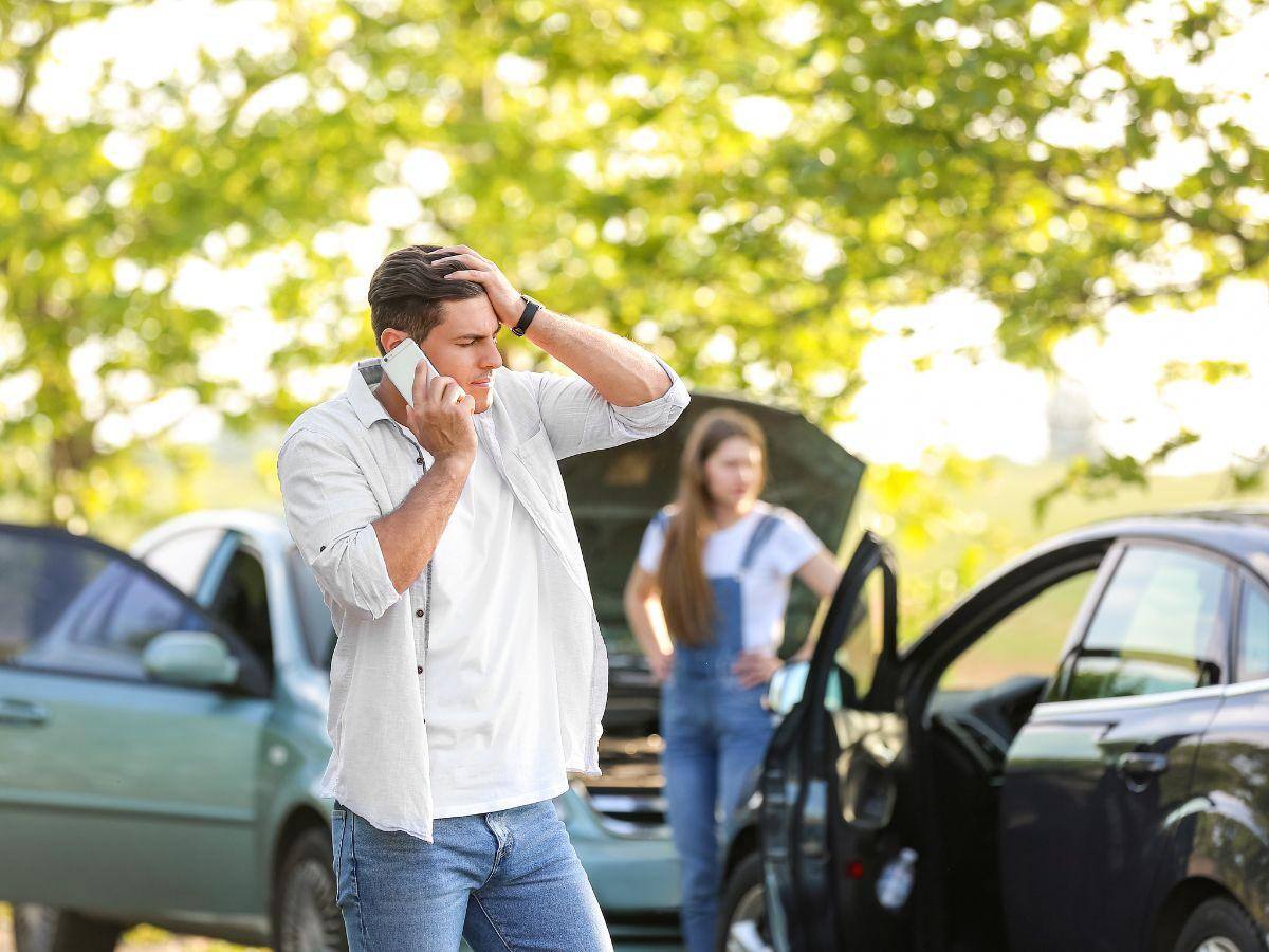 Man in Atlanta assessing the scene of a car accident